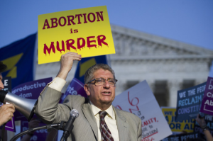 Randall Terry protests in front of the Supreme Court in Washington on July 9, 2018