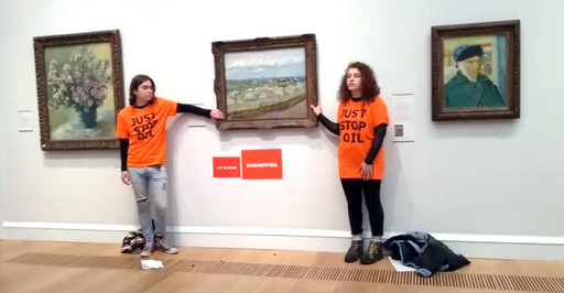 Just Stop Oil activists glue themselves to the artwork