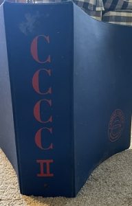 Blue folder with CCCC along the spine