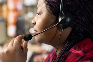 call-center-agent-using-headset-mic-answer-technical-inquiries-close-up